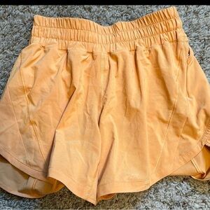 Lululemon track that shorts, monarch orange, size 4